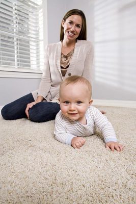 Mother and child on shag rug