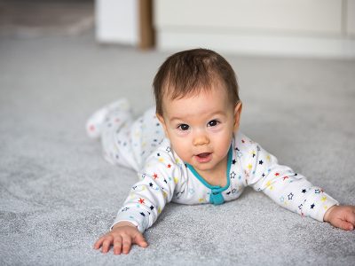 Baby crawling on carpet